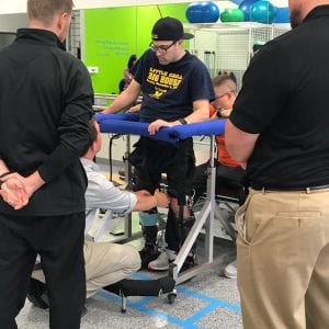 Josh uses the Gait Harness System during therapy