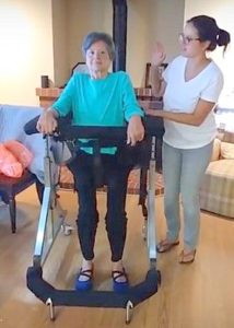 Woman rests in Gait Harness System during physical therapy